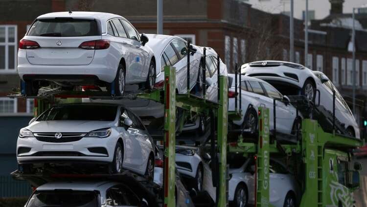 Vauxhall cars on a lorry highlight Europe's declining car sales in 2022 - Global Banking & Finance Review