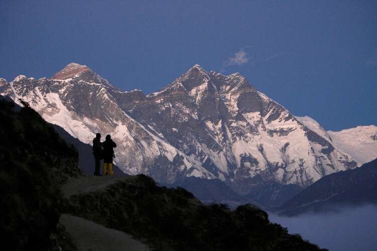 FILE PHOTO: Travellers enjoy the the view of Mount Everest at Syangboche in Nepal