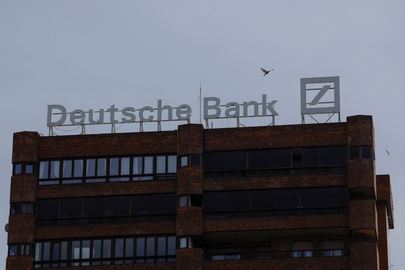 Deutsche Bank logo with a backdrop of financial charts and currency symbols - Global Banking & Finance Review