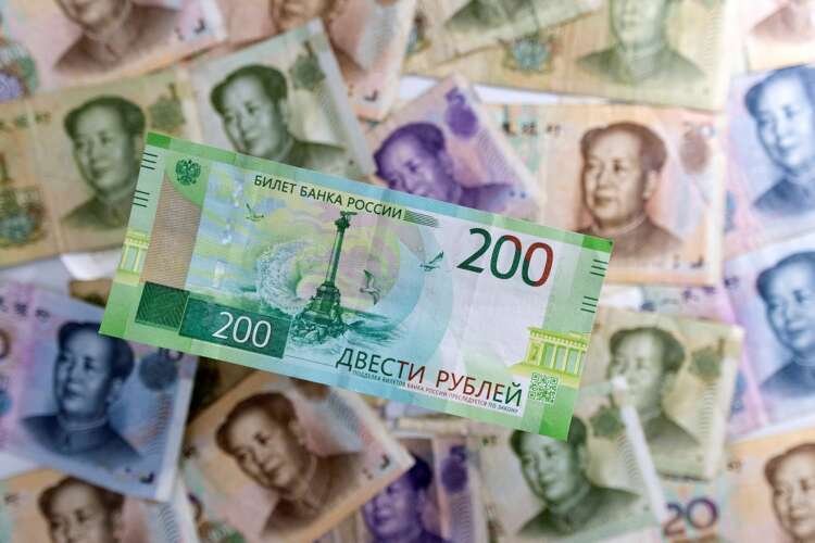 Illustration of Russian Rouble and Chinese Yuan banknotes representing global investment concerns - Global Banking & Finance Review