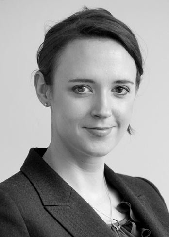 A diverse group of women in business attire discussing board representation - Global Banking & Finance Review