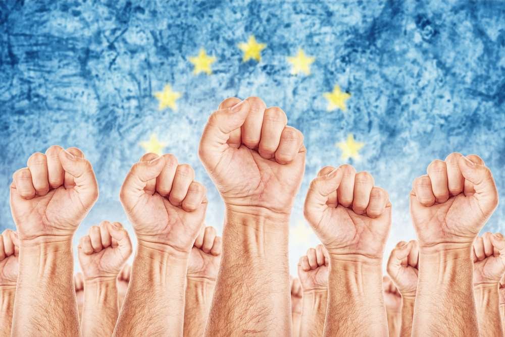 Illustration of workers discussing union formation for better rights - Global Banking & Finance Review