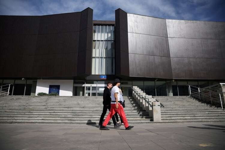 People walking in front of the National Bank of Poland in Warsaw - Global Banking & Finance Review