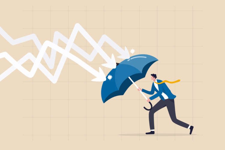Businessman with umbrella symbolizes resilience for SMEs in ESG amid economic challenges - Global Banking & Finance Review