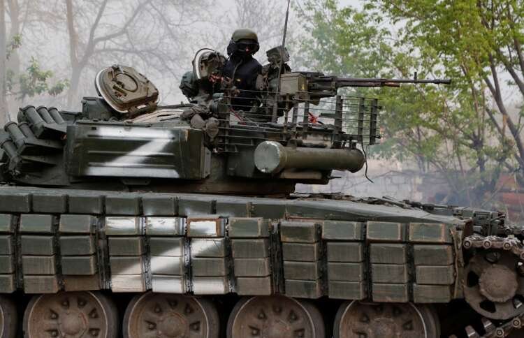 Pro-Russian military personnel observed on a tank in Mariupol amidst Ukraine crisis - Global Banking & Finance Review