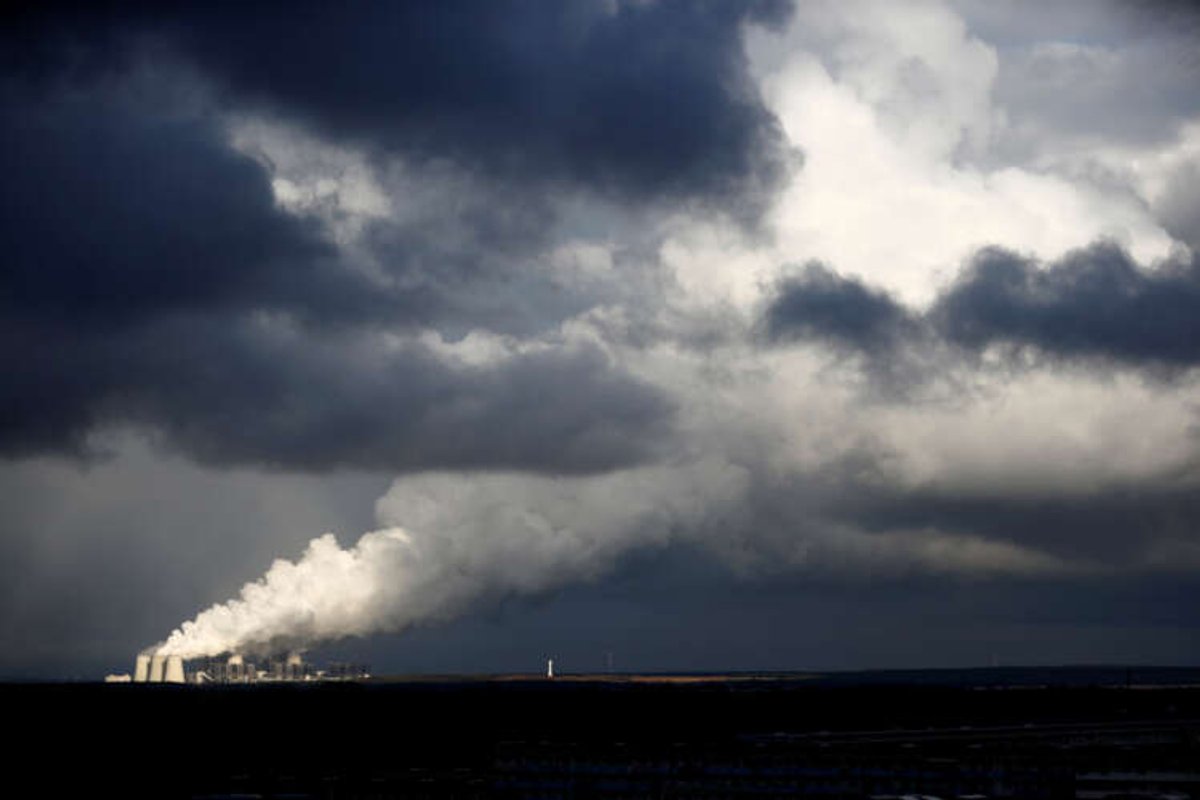 Smoke rises from the coal power plant in Jaenschwalde