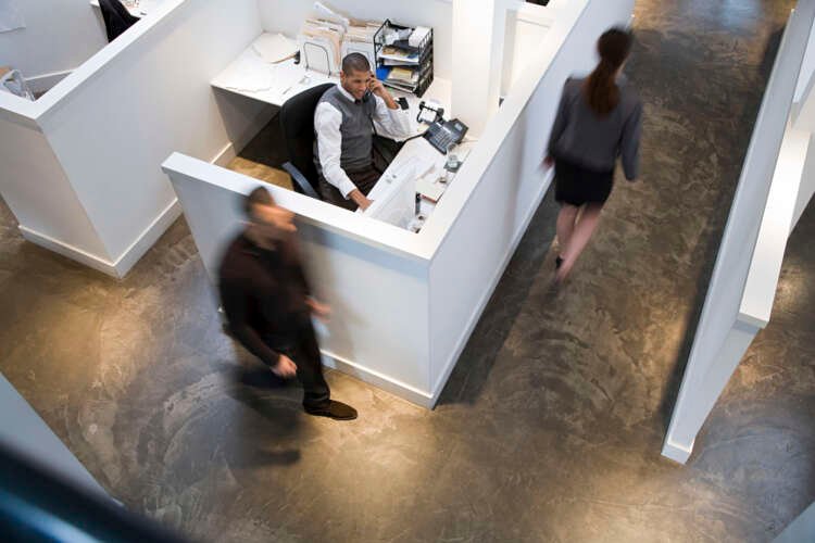 Office workers collaborating in a space designed with tent-like privacy features - Global Banking & Finance Review