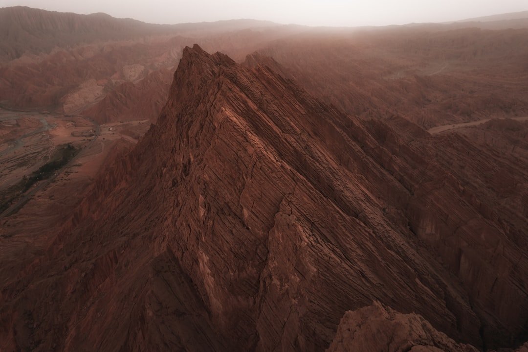 Volkswagen logo and factory image representing the sale of Xinjiang operations - Global Banking & Finance Review