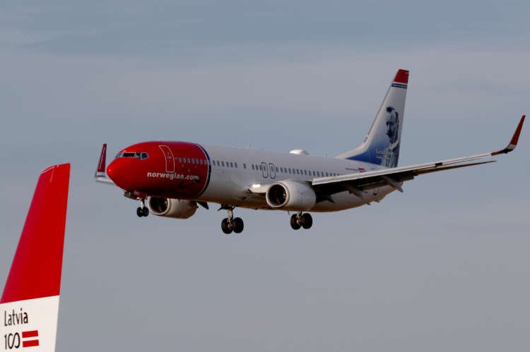 Norwegian Air Boeing 737-800 aircraft approaches Riga Airport amid legal dispute - Global Banking & Finance Review