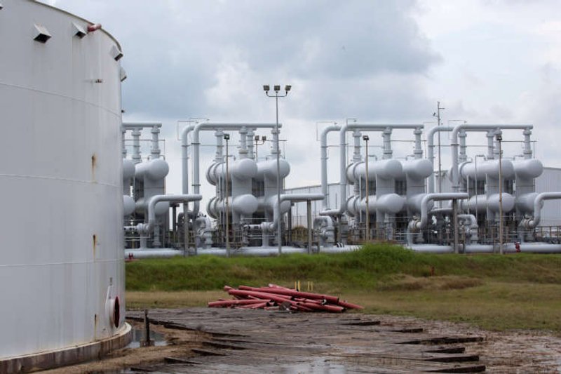 Image for Oil flat as weaker dollar offsets surge in U.S. gasoline stocks