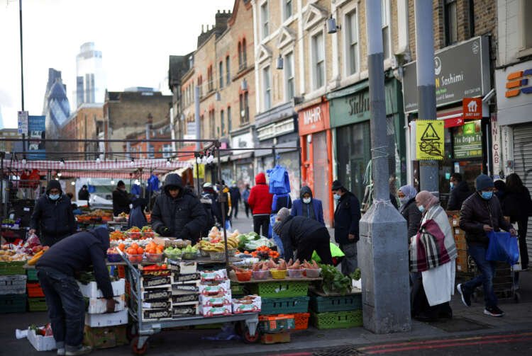 Market stalls in London showcasing consumer goods amid rising UK inflation - Global Banking & Finance Review