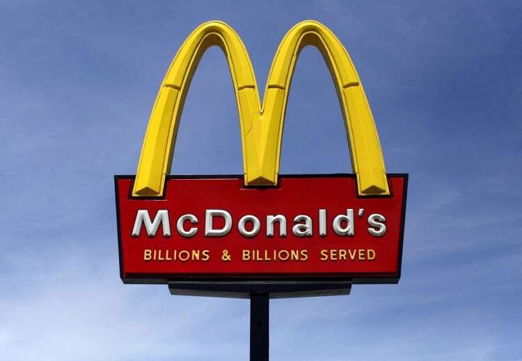 McDonald's restaurant sign prominently displayed, related to labor settlement news - Global Banking & Finance Review