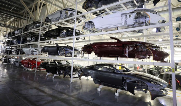 Car bodies stored at Aston Martin factory, highlighting UK-EU trade discussions - Global Banking & Finance Review