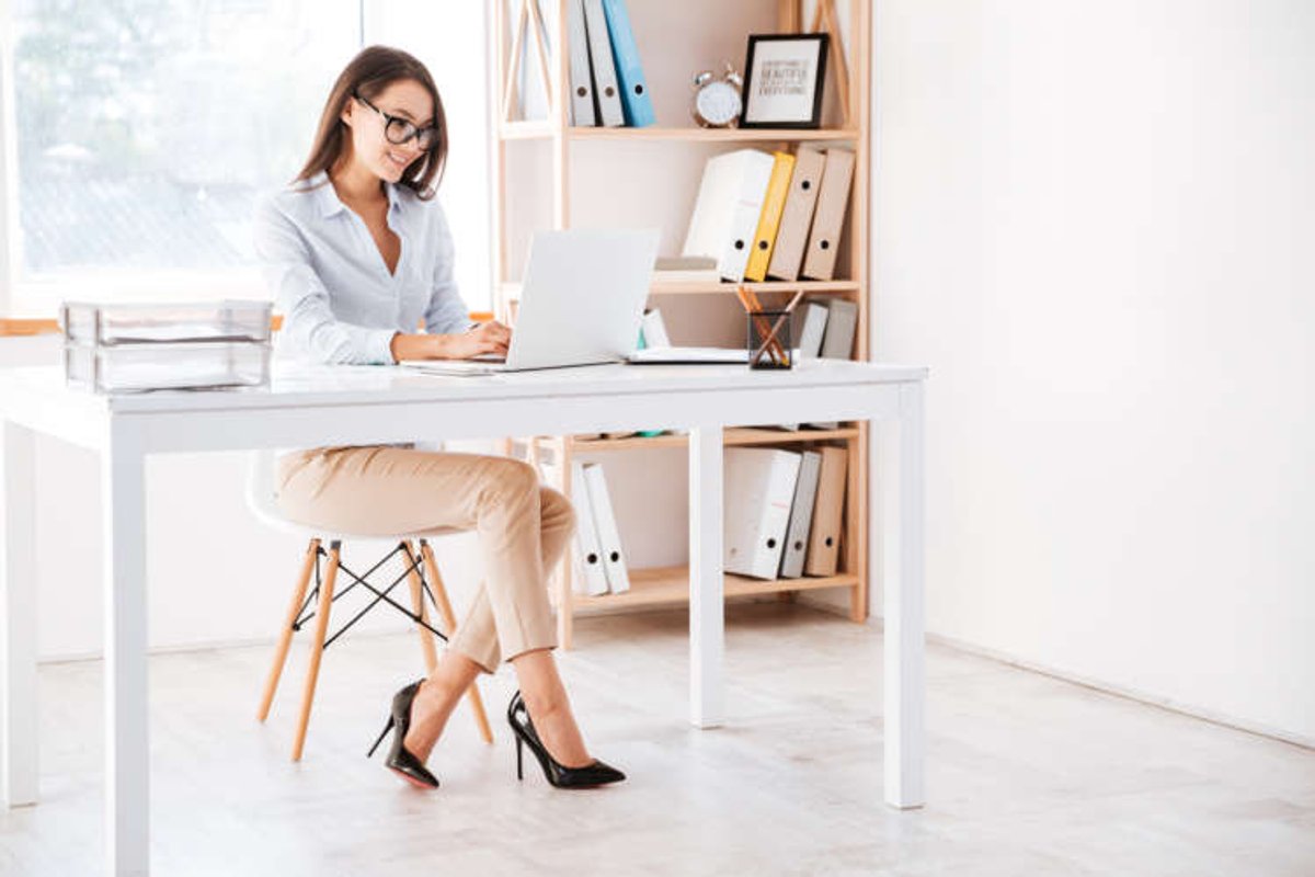 Businesswoman using laptop in office