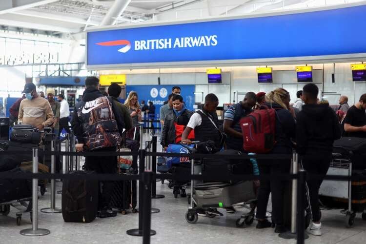 Travelers at Heathrow Airport preparing for Easter travel amidst easing COVID restrictions - Global Banking & Finance Review