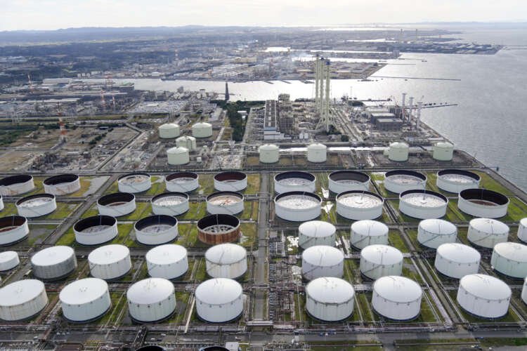 Aerial view of an oil factory, reflecting the impact of falling oil prices on global markets - Global Banking & Finance Review
