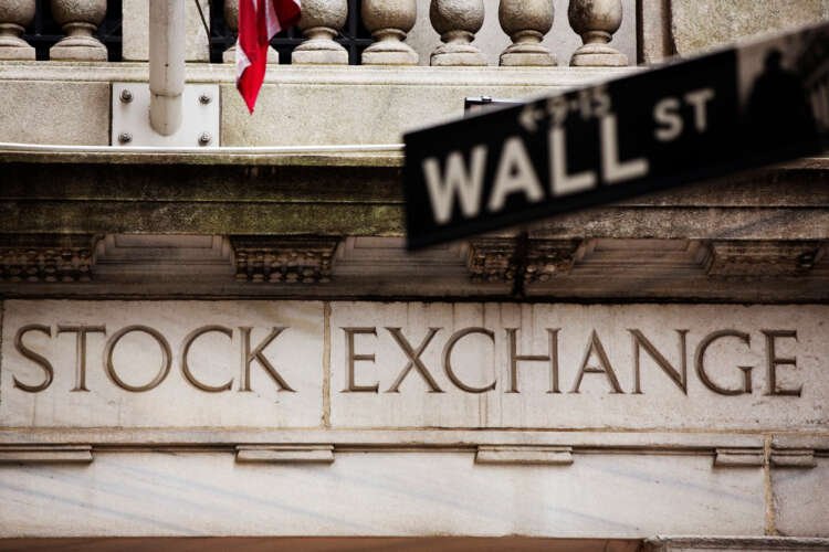 Wall Street sign in front of the New York Stock Exchange amid rising U.S. bond yields - Global Banking & Finance Review