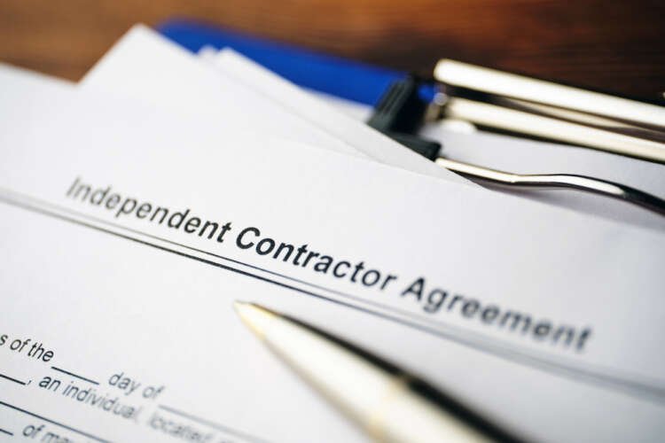 Close-up of an Independent Contractor Agreement document - Global Banking & Finance Review