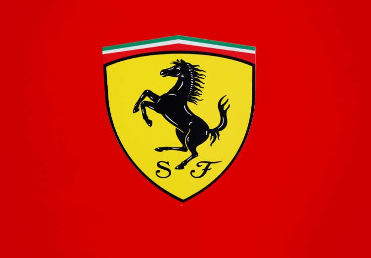 Luxury car Ferrari logo with Jony Ive and Exor partnership announcement - Global Banking & Finance Review