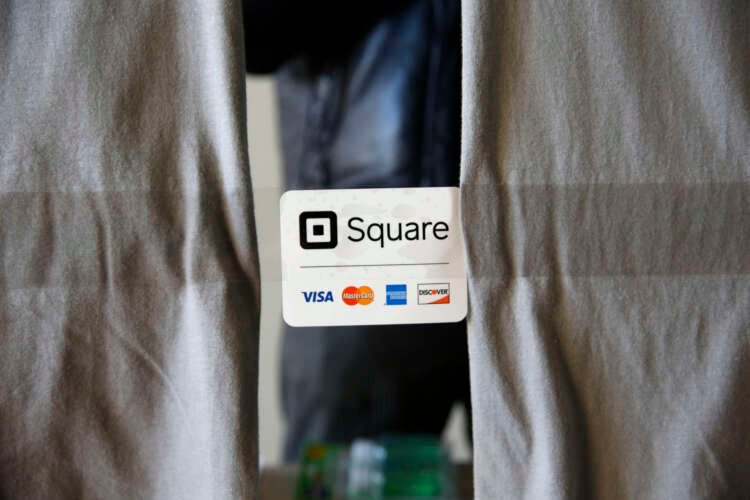 An advertisement for the Square payment processor is seen outside a vendors site along the High Line in New York