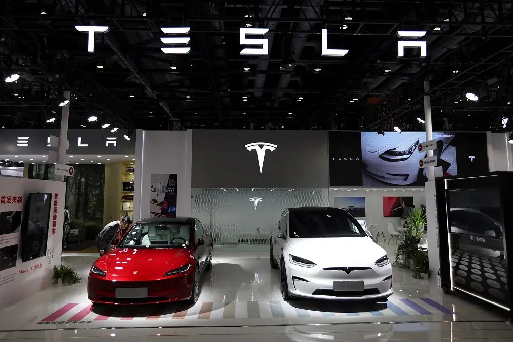 Tesla electric vehicles on display, showcasing competition with BYD in EV market - Global Banking & Finance Review