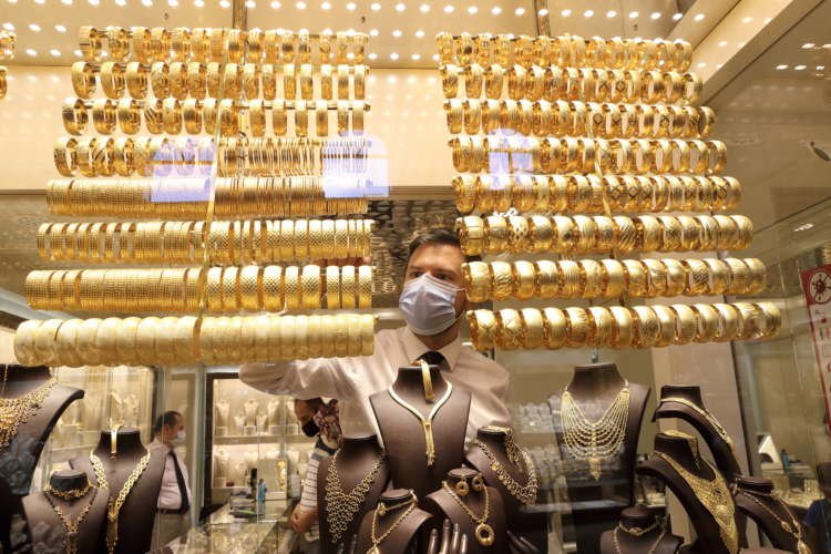 Image for Analysts cut gold forecasts as economic growth recovers: Reuters poll