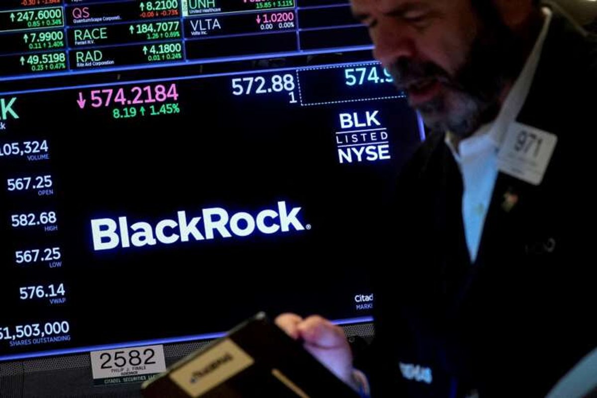 Trader monitors BlackRock trading data at NYSE amid UK property fund risks - Global Banking & Finance Review