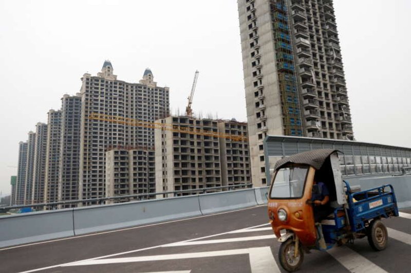 Image for China Evergrande default fears haunt investors as Beijing stands back, for now