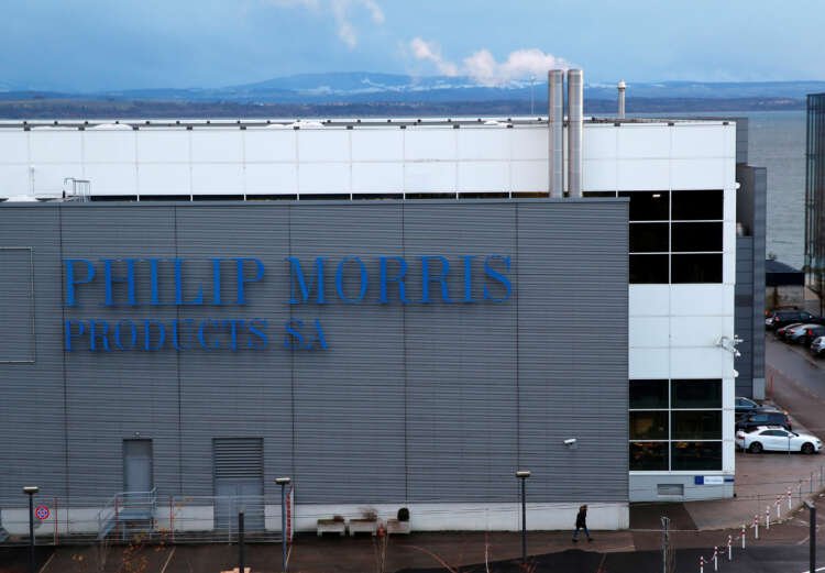 Philip Morris logo in front of a factory, highlighting the EU concessions in Swedish Match deal - Global Banking & Finance Review