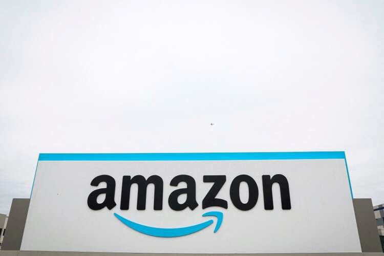 Amazon logo displayed outside a sortation center amid significant job cuts - Global Banking & Finance Review