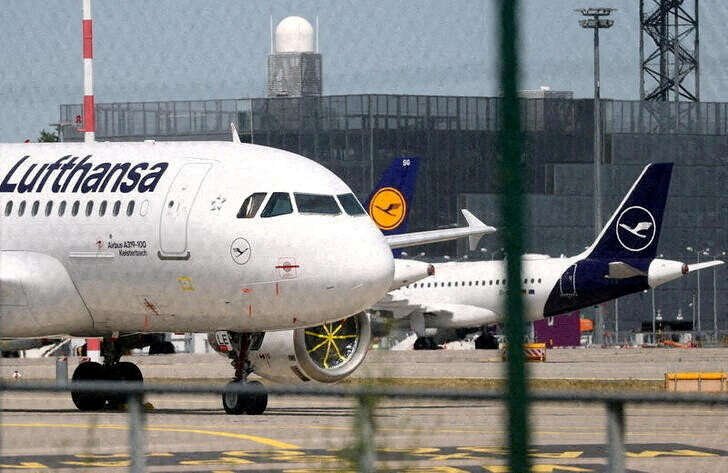 Lufthansa planes parked at Frankfurt airport, representing Kuehne's stake in the airline - Global Banking & Finance Review