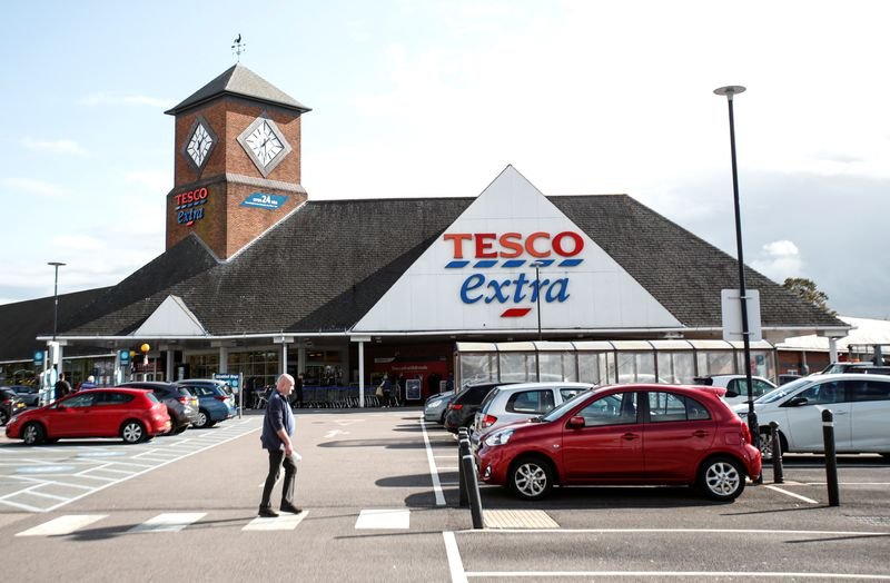 Image of Tesco store exterior representing job cuts in UK retail - Global Banking & Finance Review