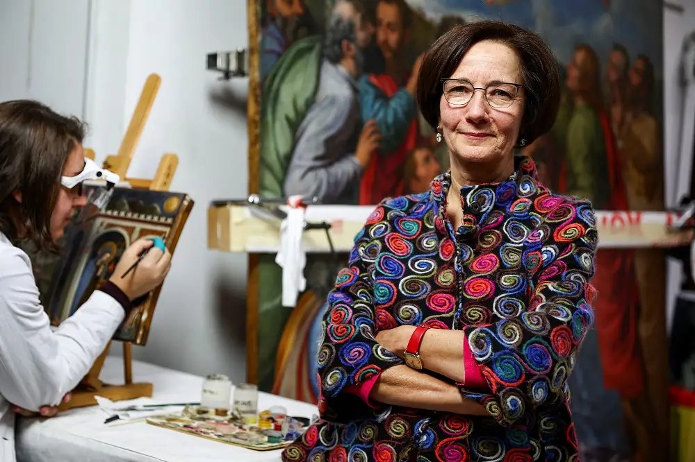 Vatican restoration expert working on a painting by Moretto - Global Banking & Finance Review