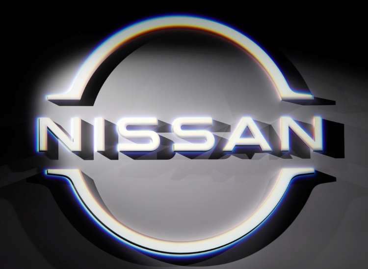 FILE PHOTO: The brand logo of Nissan Motor Corp. is displayed during a press preview of the company’s new Ariya all-battery SUV in Yokohama