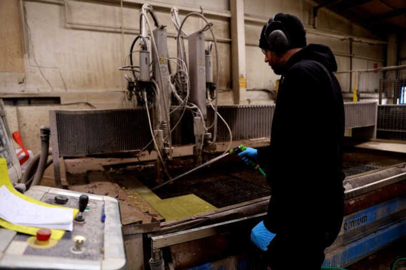 Image for Factory slump and cost-of-living squeeze puts UK economy on course to shrink