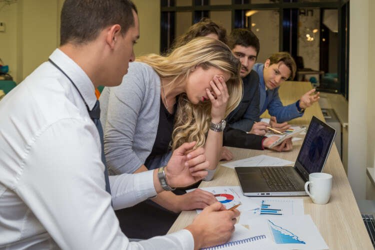 Unhappy businesswoman on a corporate meeting