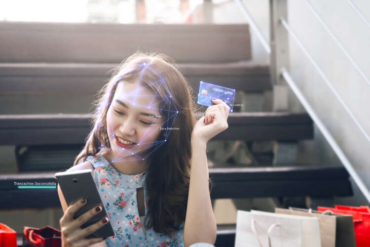 Adult Asian woman using mobile phone for digital payments in 2023 - Global Banking & Finance Review