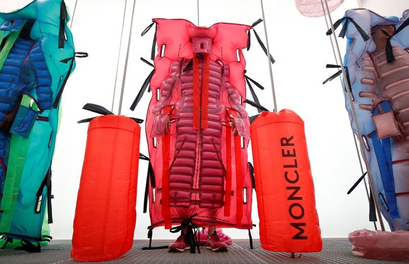 Moncler's logo with luxury outerwear, reflecting growth in China - Global Banking & Finance Review