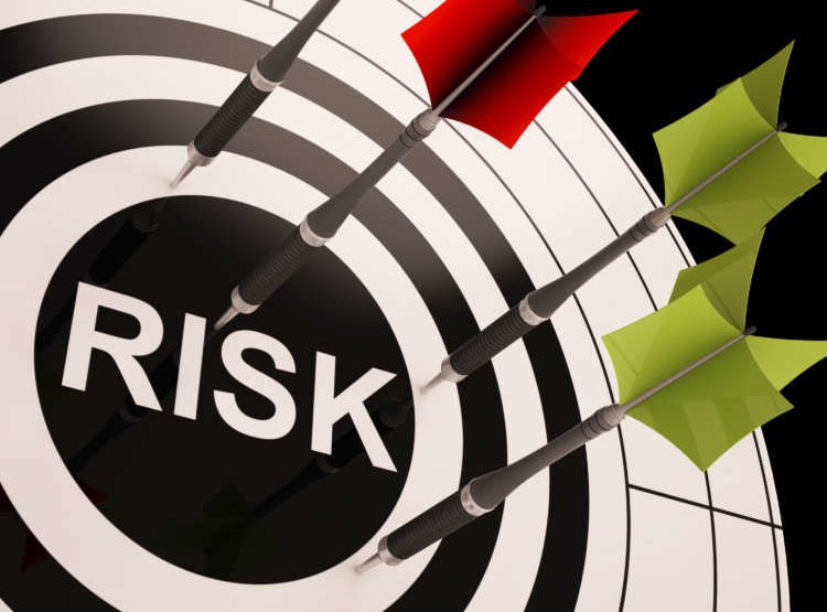 Dartboard with risks highlighted, symbolizing key threats in banking - Global Banking & Finance Review