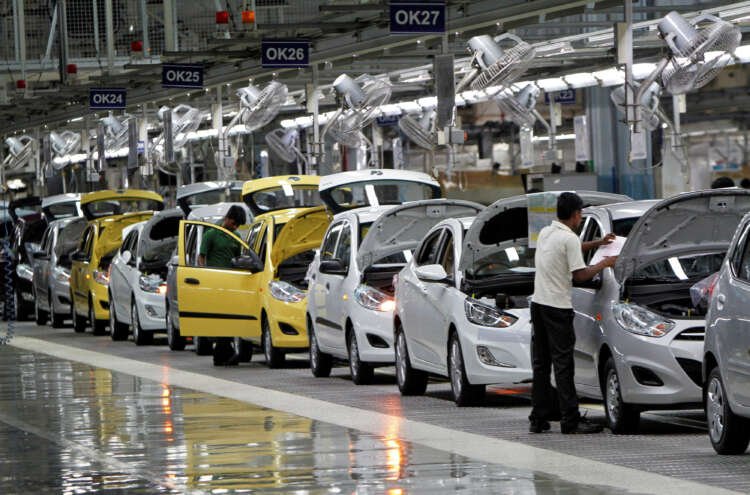 Workers assembling cars at Hyundai's Tamil Nadu plant related to India's auto industry - Global Banking & Finance Review