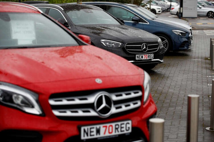 New cars displayed at a dealership, highlighting UK's 20% rise in registrations - Global Banking & Finance Review
