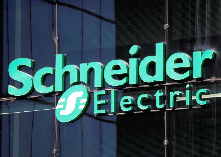 Logo of Schneider Electric at headquarters, highlighting potential AVEVA buyout - Global Banking & Finance Review
