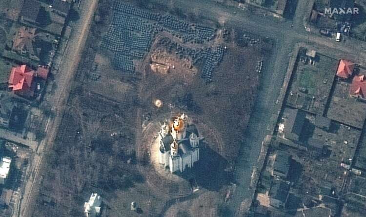 FILE PHOTO: A satellite image shows the grave site near the Church of St. Andrew and Pyervozvannoho All Saints, in Bucha