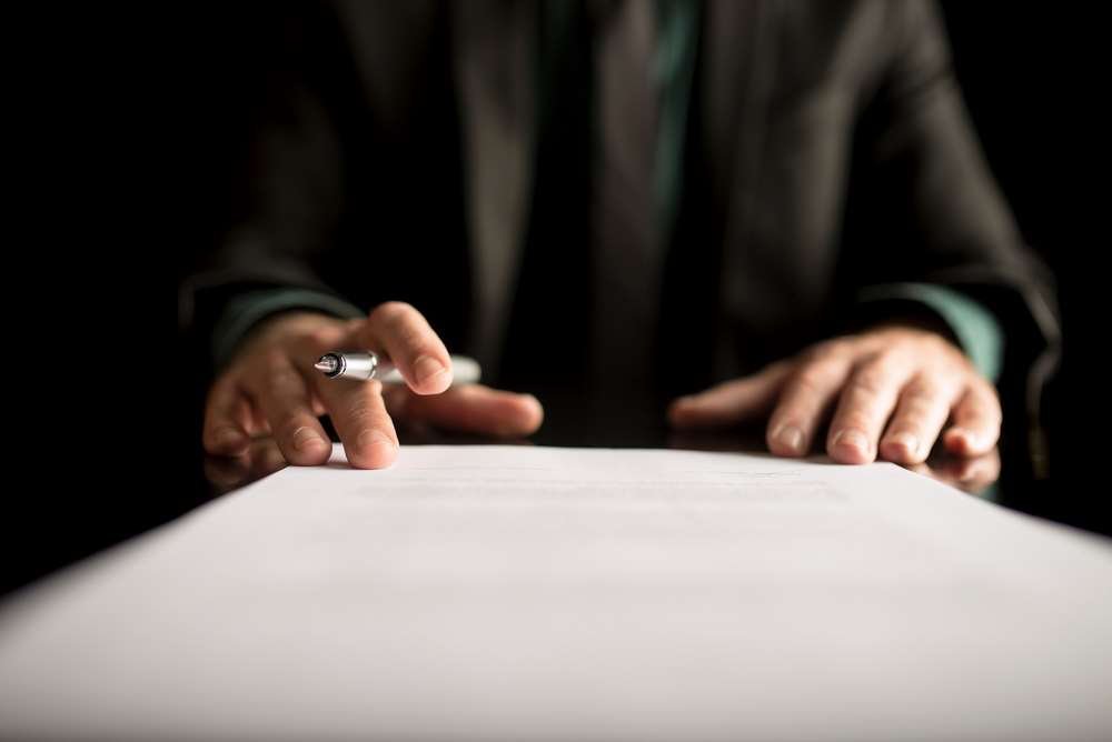 Illustration of a person brainstorming ideas for a personal statement - Global Banking & Finance Review