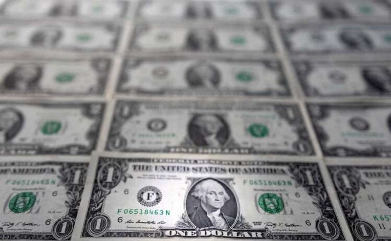 Image for Dollar slides from near two-year high amid hawkish signals from Fed