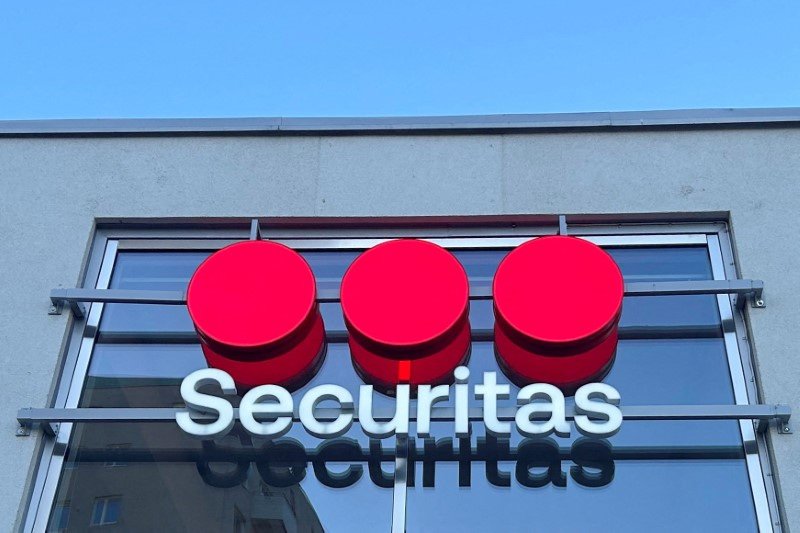 Securitas logo and financial growth chart illustrating Q4 profit rise - Global Banking & Finance Review