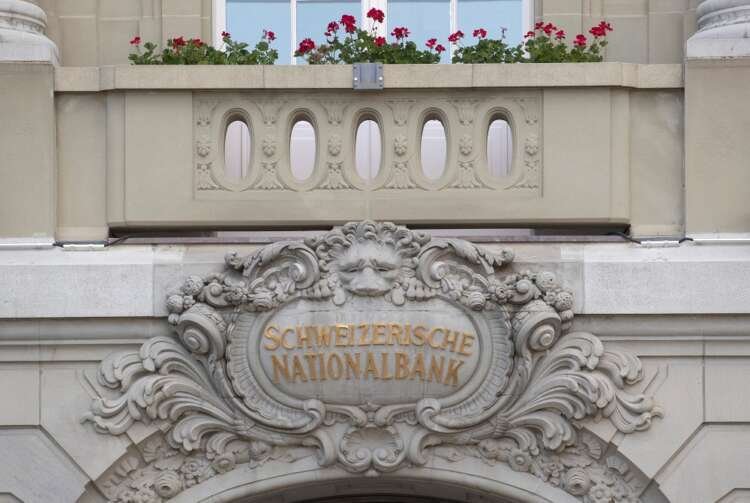 Swiss National Bank logo outside its headquarters in Bern, illustrating recent financial changes - Global Banking & Finance Review