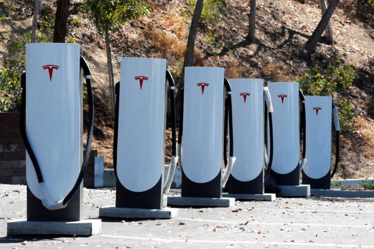 Tesla Supercharging station showcasing car chargers, relevant to Volkswagen's NACS adoption discussions - Global Banking & Finance Review