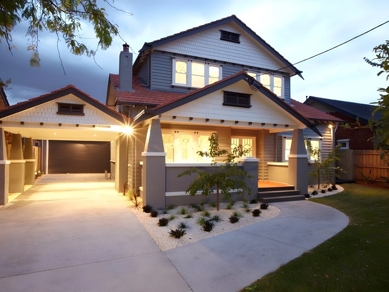 Front of the Carnegie custom home at dusk
