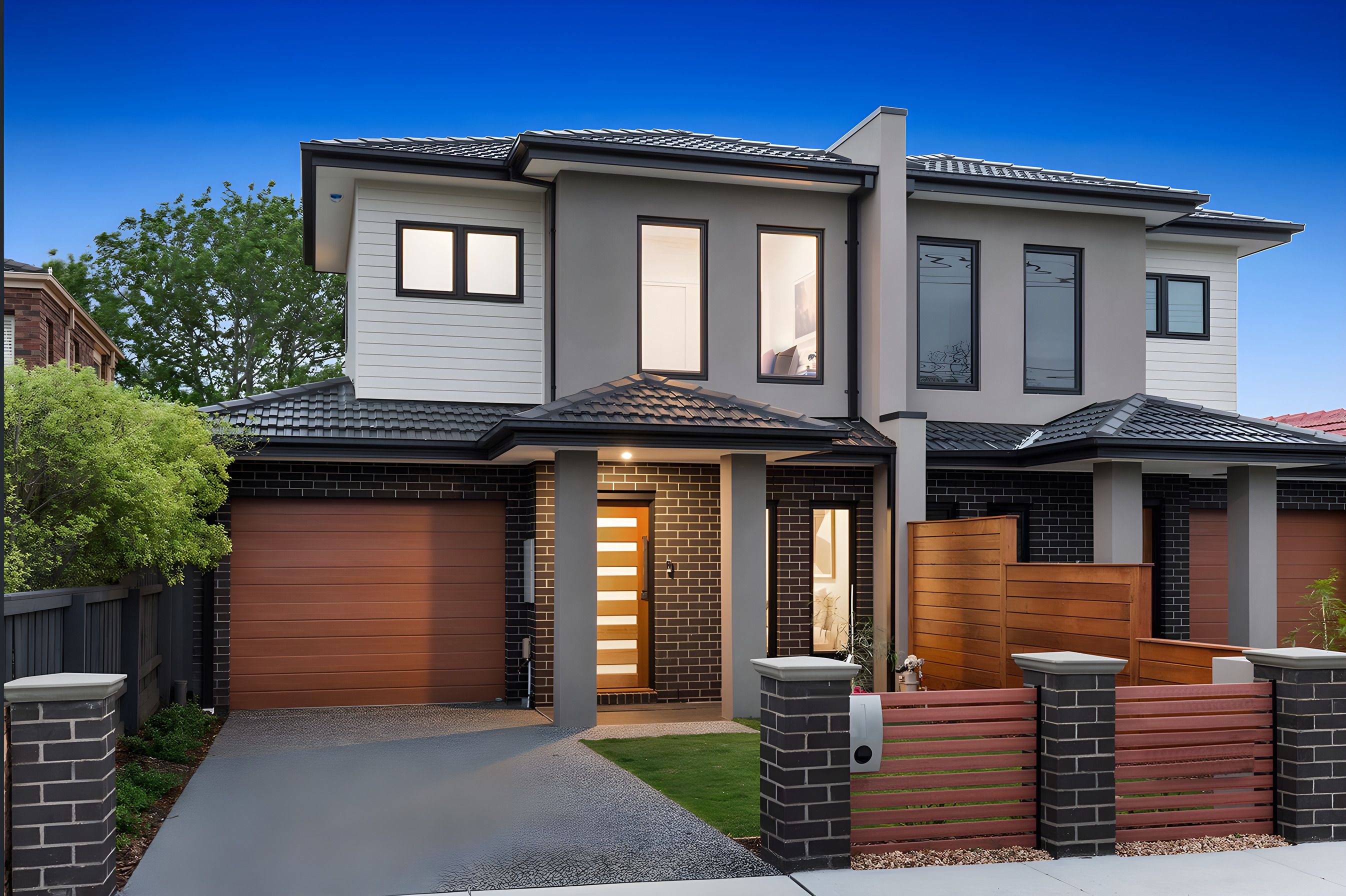 Front of the Bentleigh East side by side townhouses at dusk